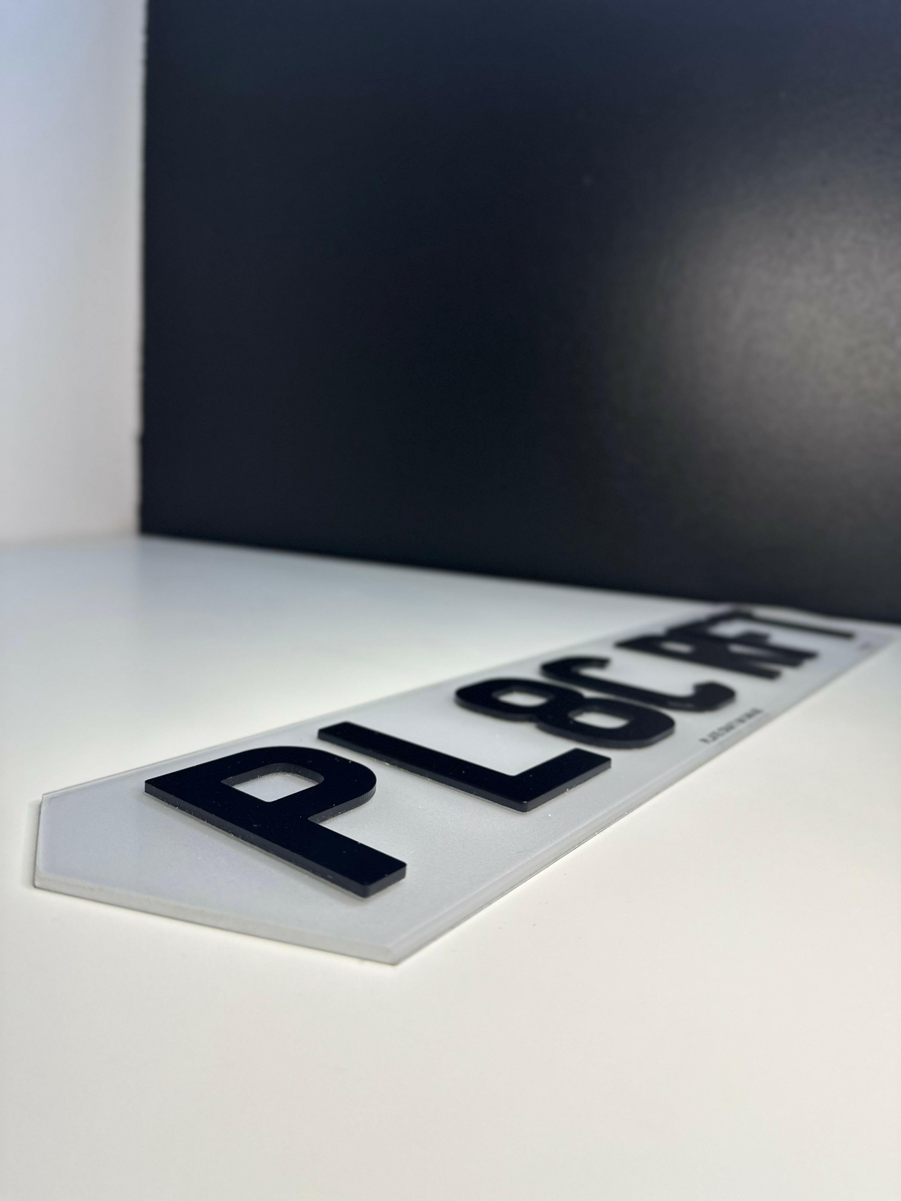 Stylish hex number plate in 3D domed lettering, mounted on a modified car