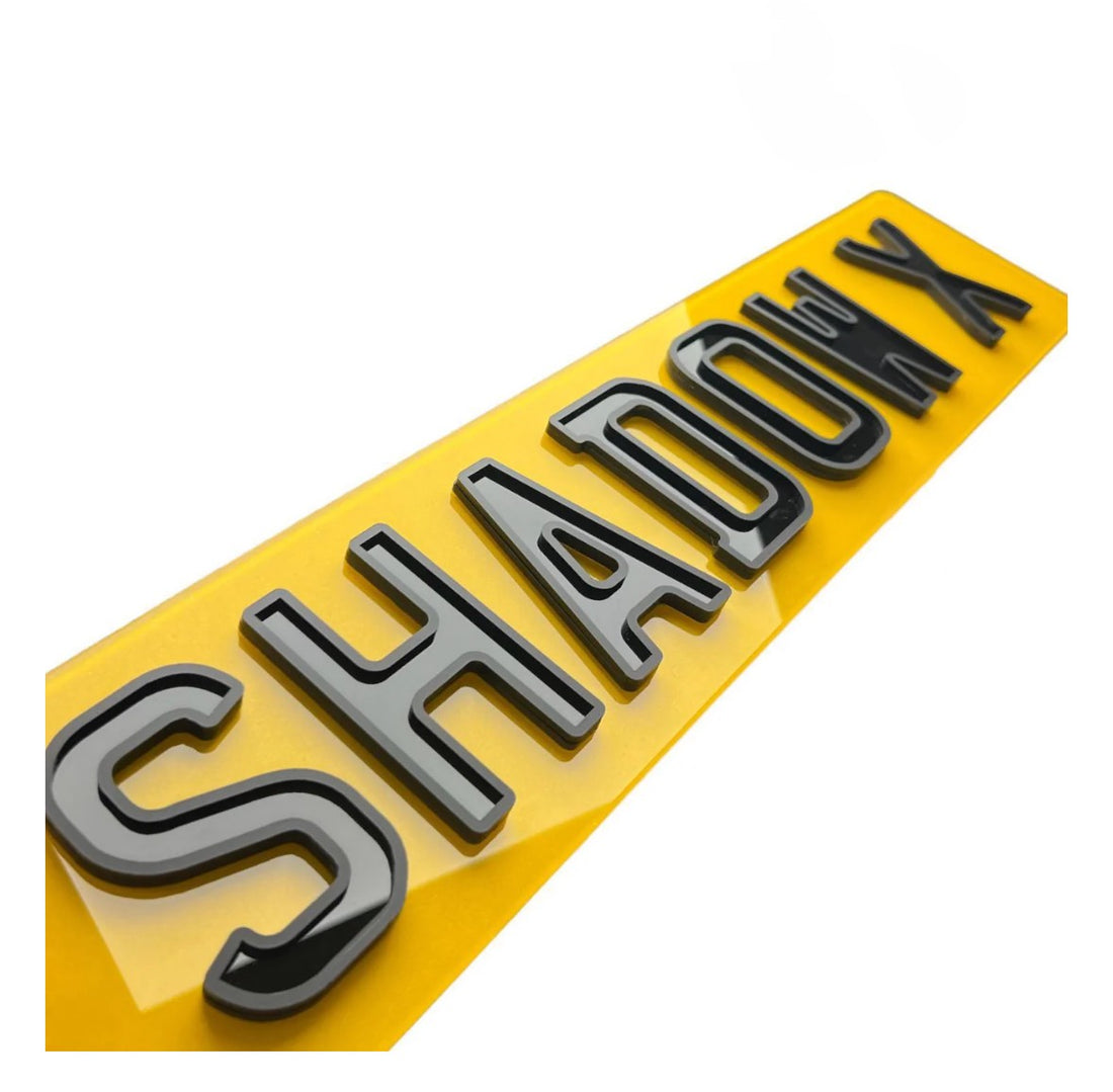 Shadow X Number Plate with matte and gloss layered 4D characters mounted on a high-end vehicle